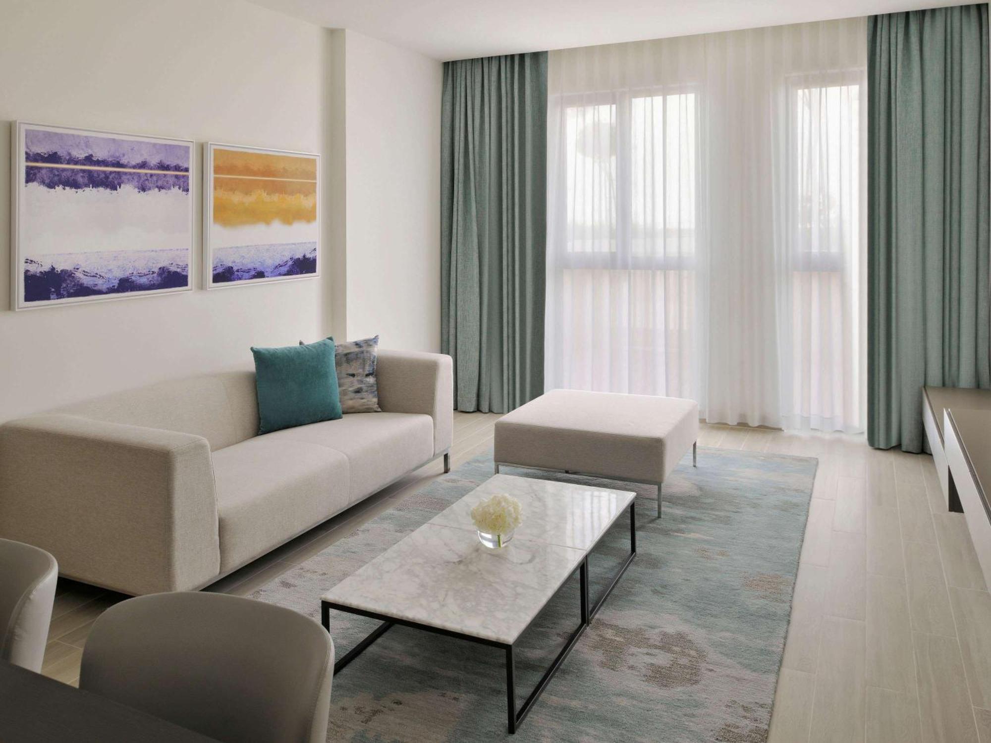 Moevenpick Hotel & Apartments Ghala Muscat Exterior photo A living room