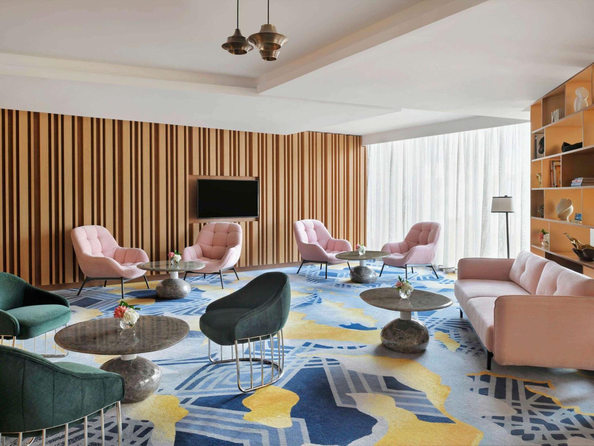 Moevenpick Hotel & Apartments Ghala Muscat Exterior photo The Living Room