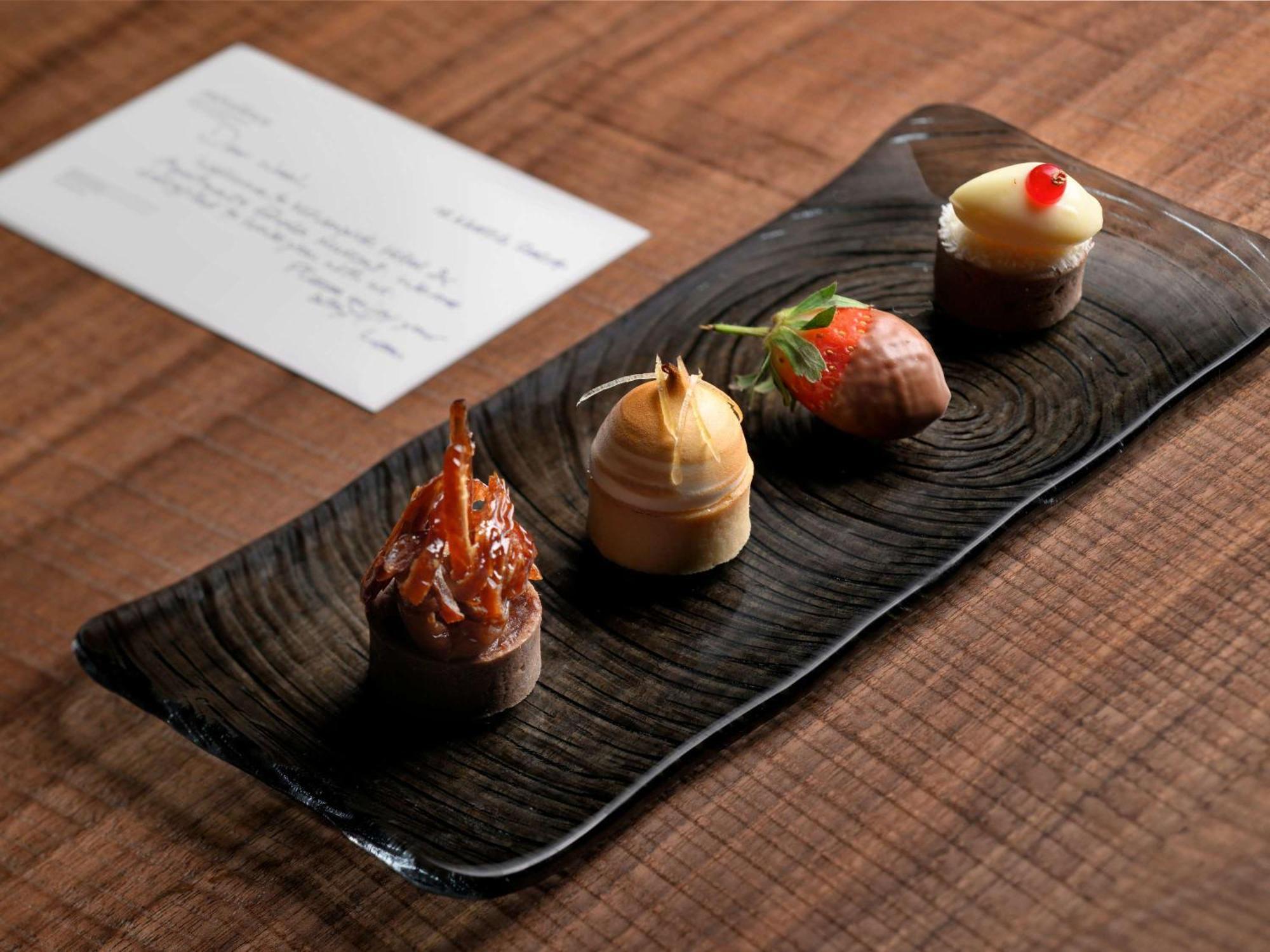 Moevenpick Hotel & Apartments Ghala Muscat Exterior photo A selection of petit fours